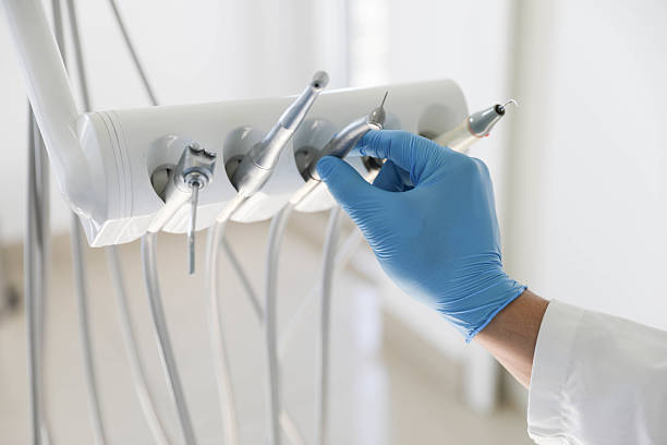 Professional Tooth Extraction technician working in Wollochet, WA